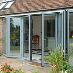 Grey aluminium bifold doors help create a look of luxury